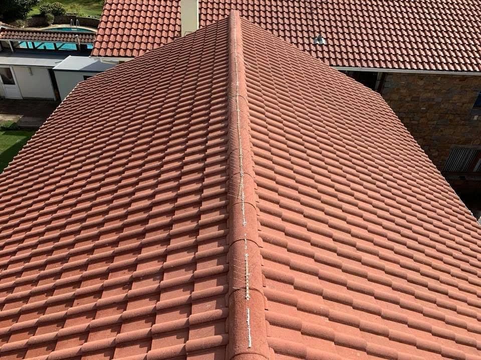 After: the same clay tile roof, clean